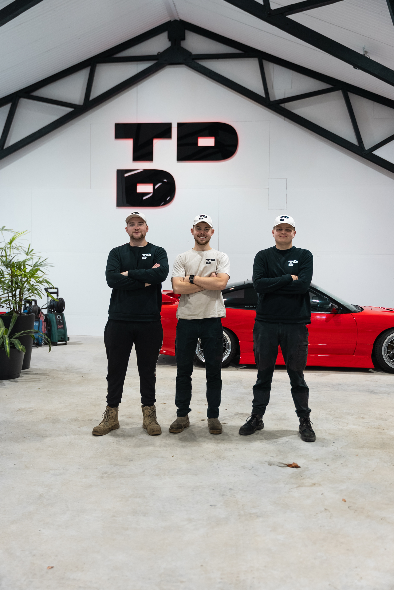 Top Down Detailing team - Sam, Harrington, and Brendan in workshop